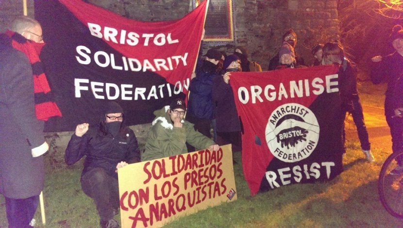 ¡Solidaridad con los presos anarquistas! from members of Bristol Anarchist Federation (IFA), Bristol Solidarity Federation (IWA) and friends